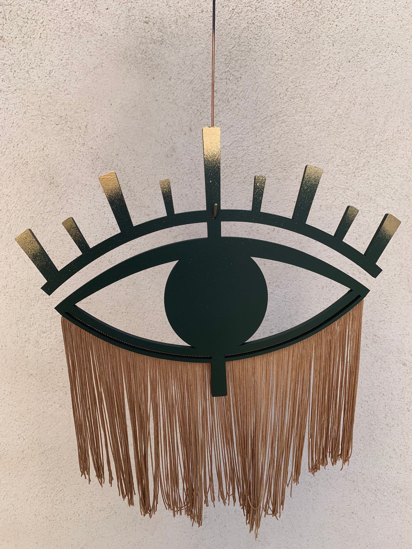 Decorative eye in wood and cotton thread