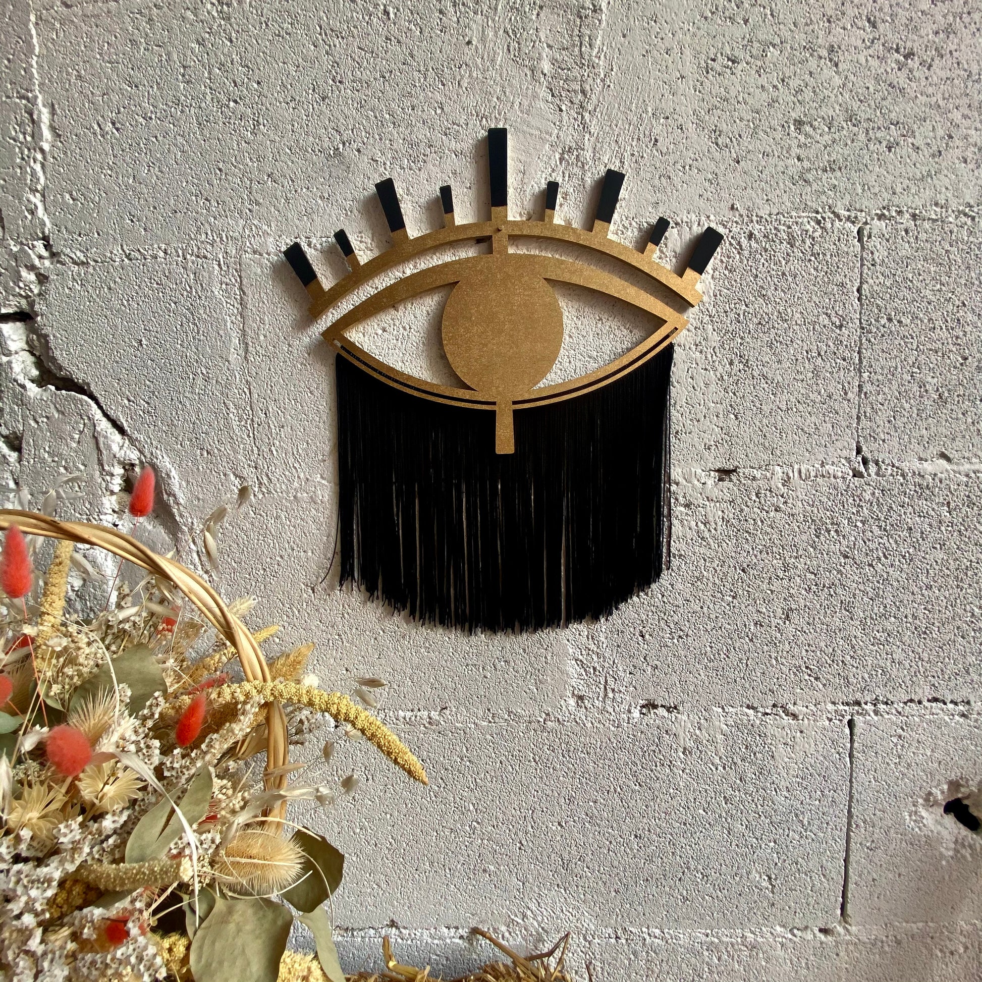 décoration murale oeil de la bonté or